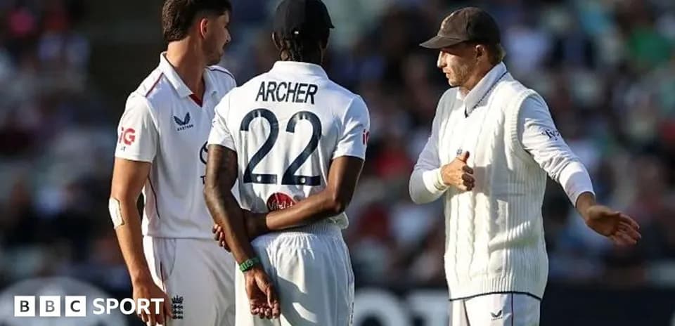 Three cricketers discussing on the field during match