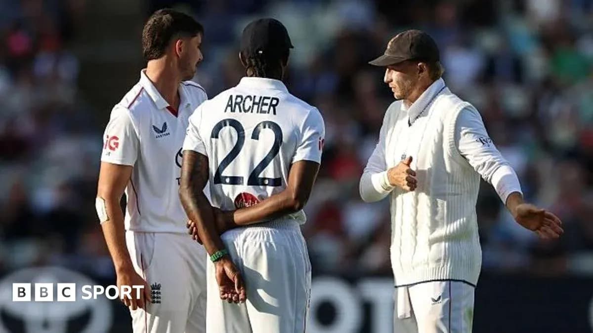 Three cricketers discussing on the field during match