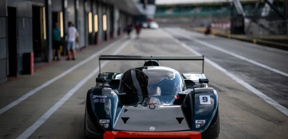 Race car on pit lane at racetrack