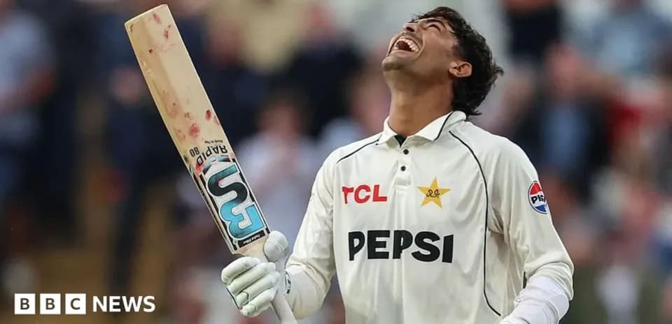 Cricketer celebrating with bat after scoring