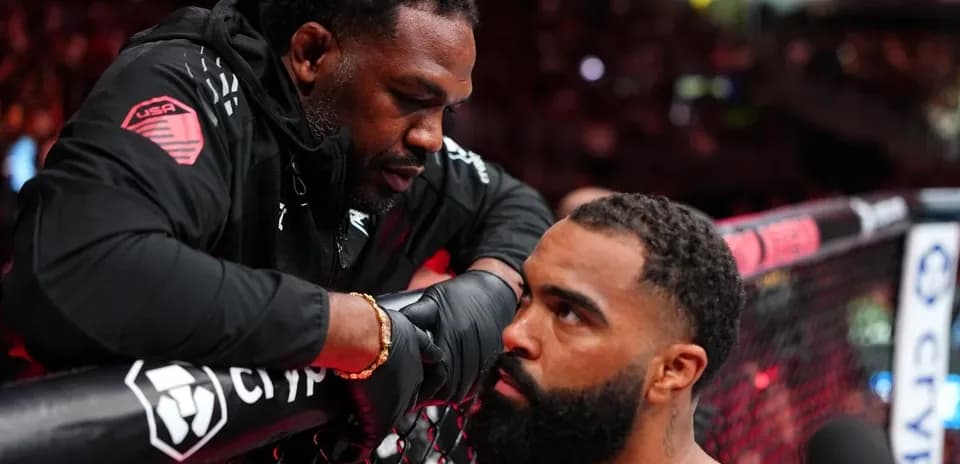 Coach giving advice to fighter in the corner