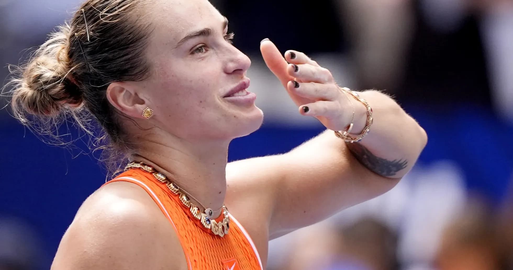 Tennis player celebrating after a match victory