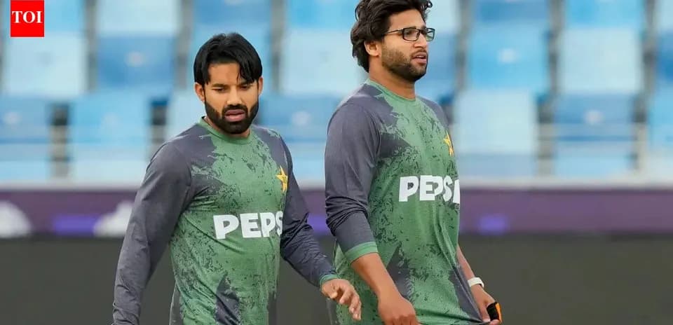 Two Pakistan players walking during practice session