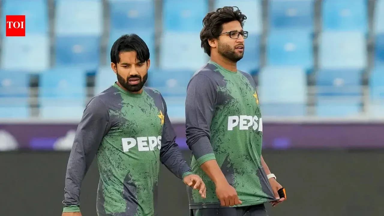 Two Pakistan players walking during practice session
