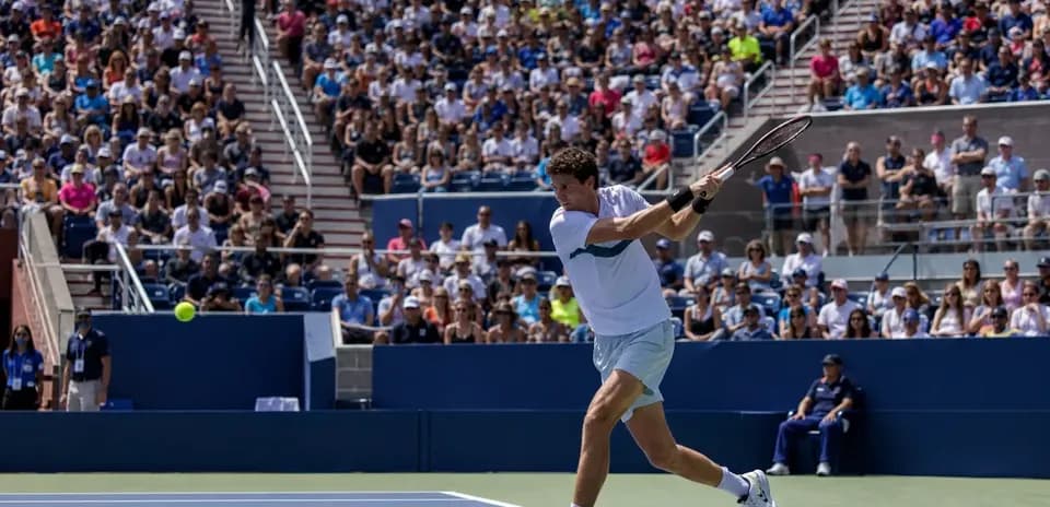 Player hitting a forehand during tennis match