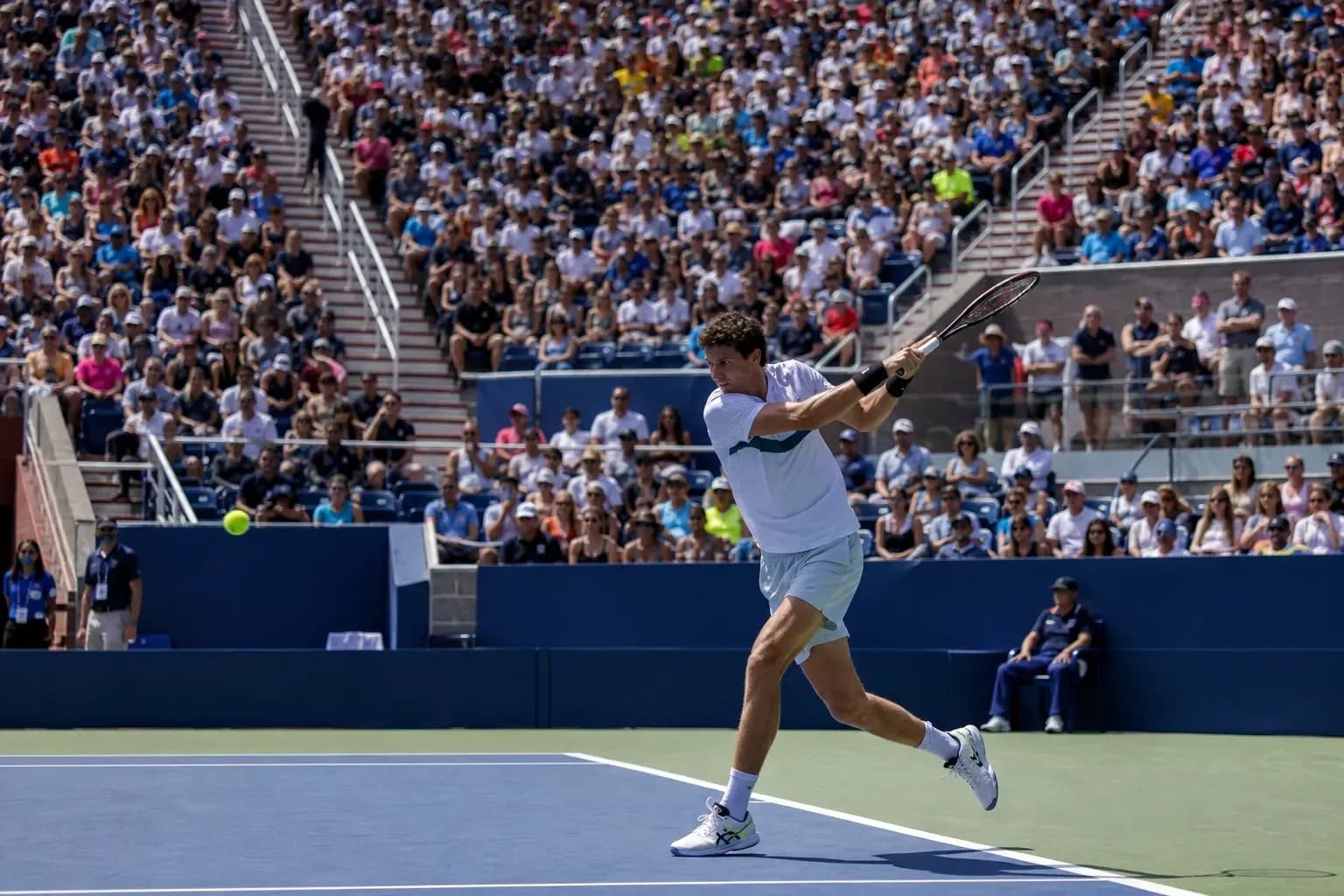 Player hitting a forehand during tennis match