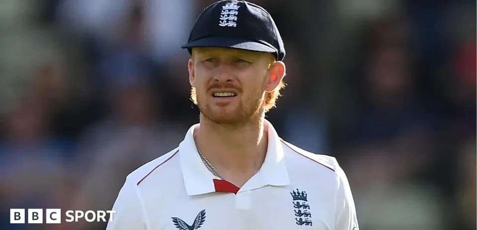 Cricketer wearing England kit during match