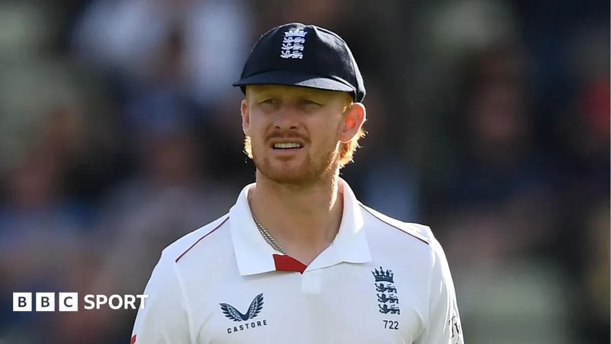 Cricketer wearing England kit during match
