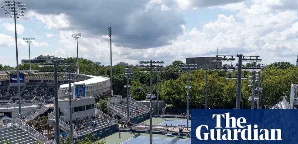 View of tennis courts and stadium under cloudy sky