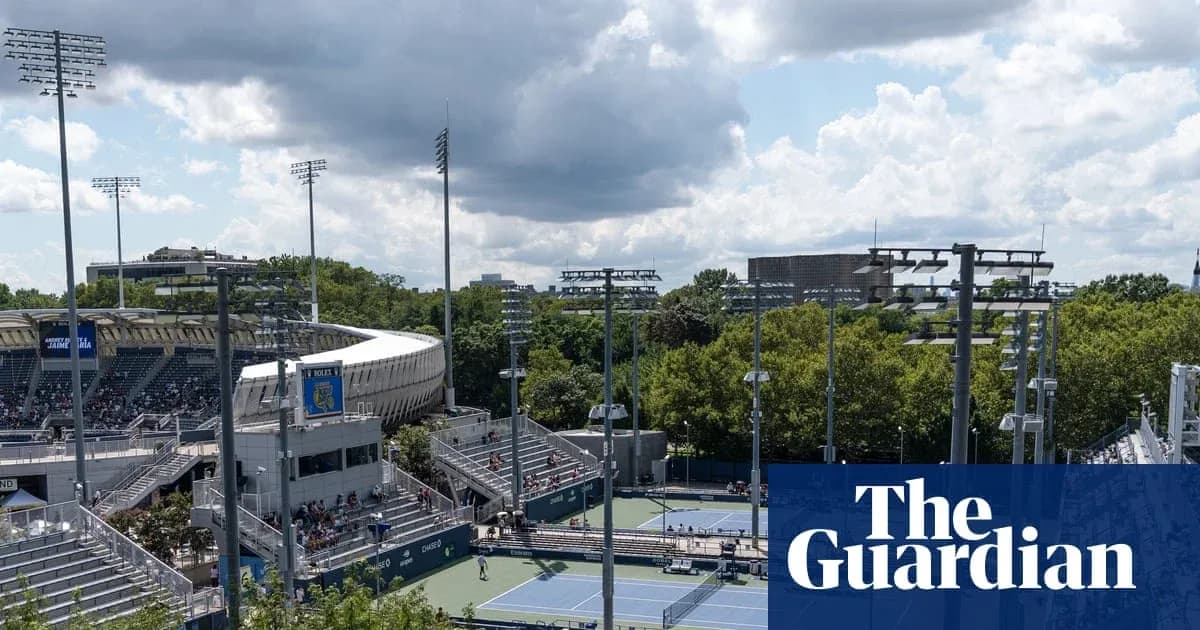 View of tennis courts and stadium under cloudy sky