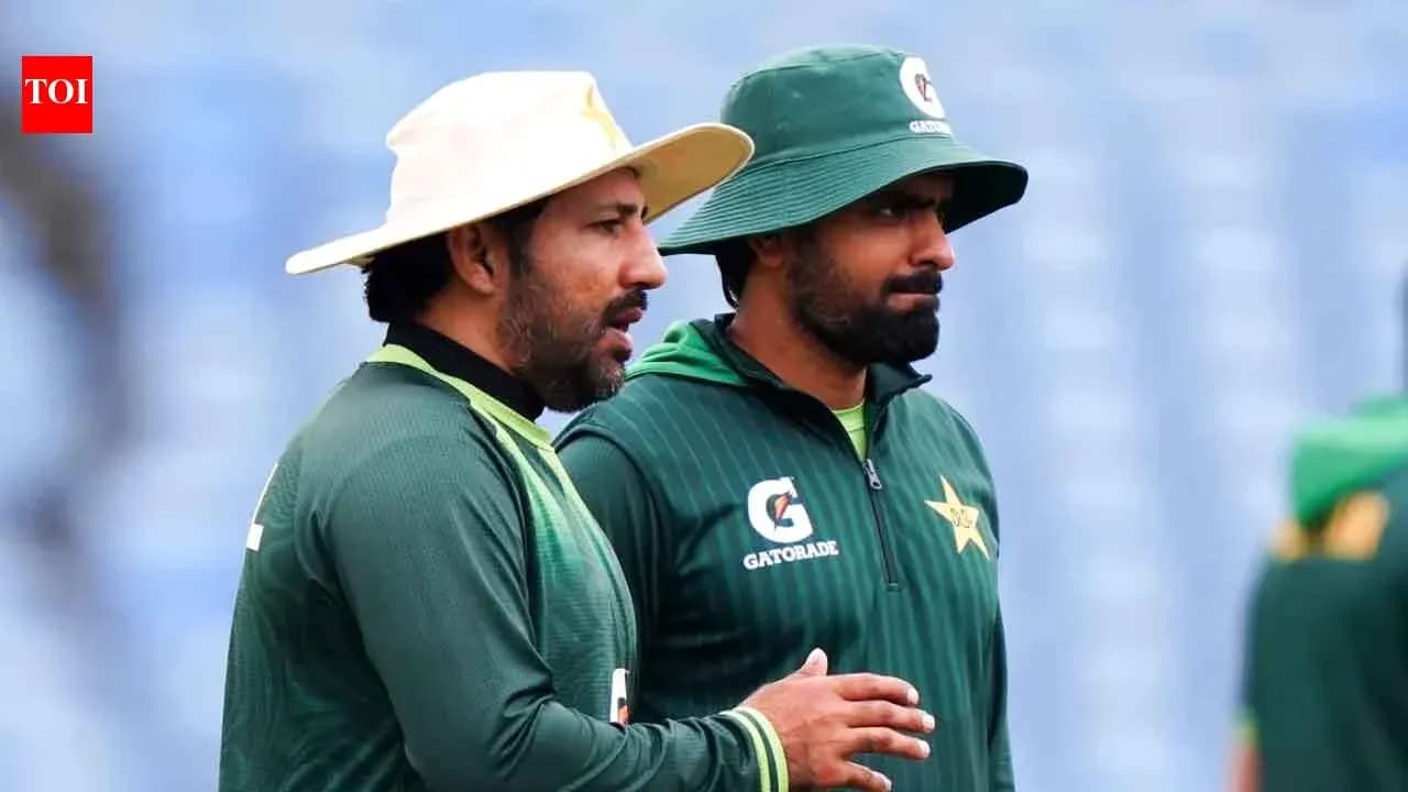 Two cricketers discussing during practice session