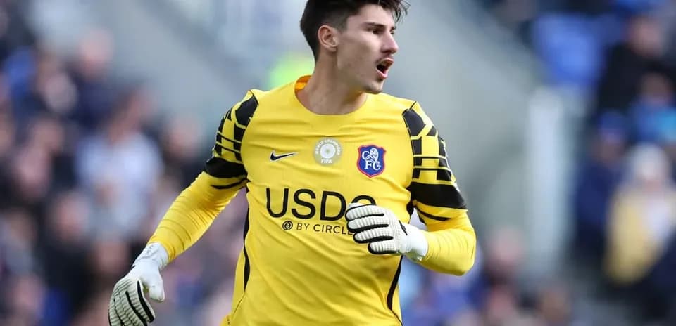 Goalkeeper in yellow kit during match action