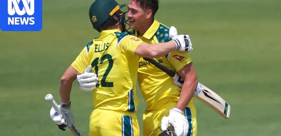 Two Australian cricketers celebrating on field