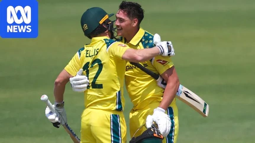 Two Australian cricketers celebrating on field