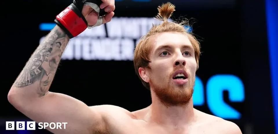 Fighter celebrating victory in the octagon