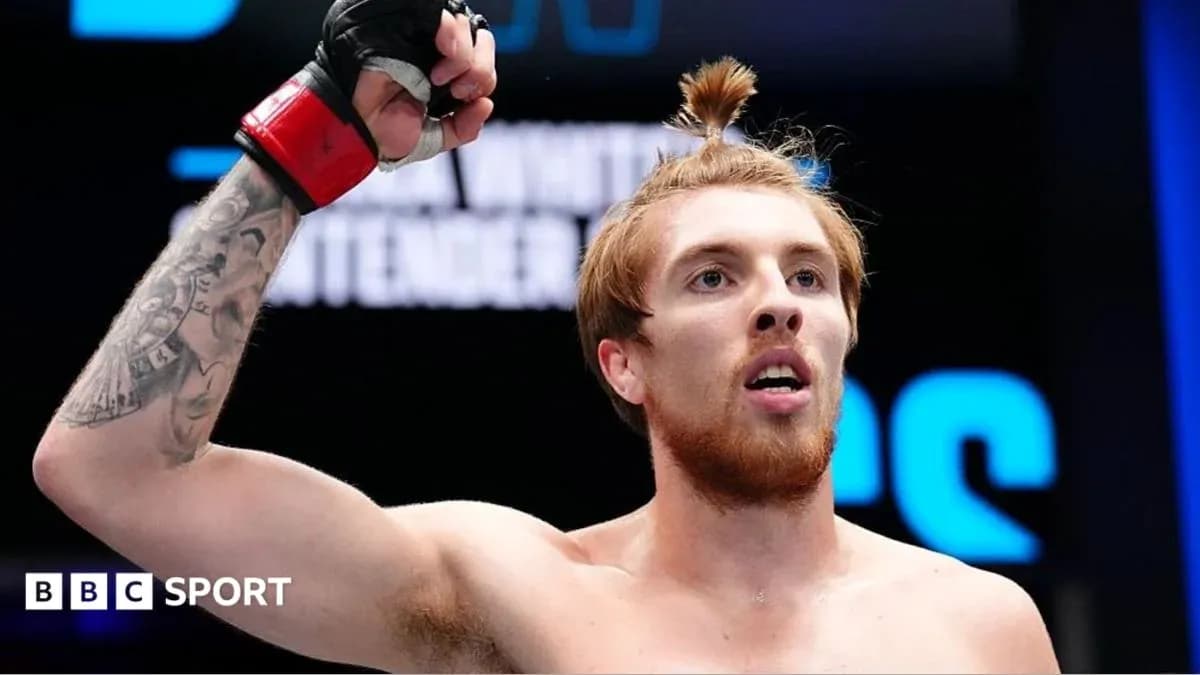 Fighter celebrating victory in the octagon