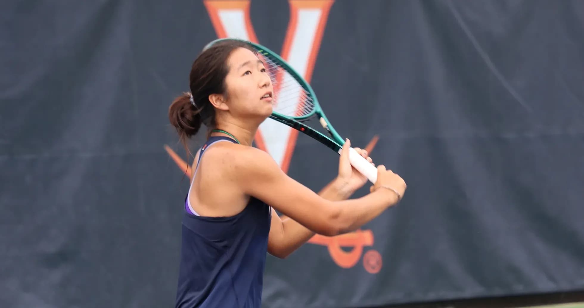 Tennis player preparing to hit a serve
