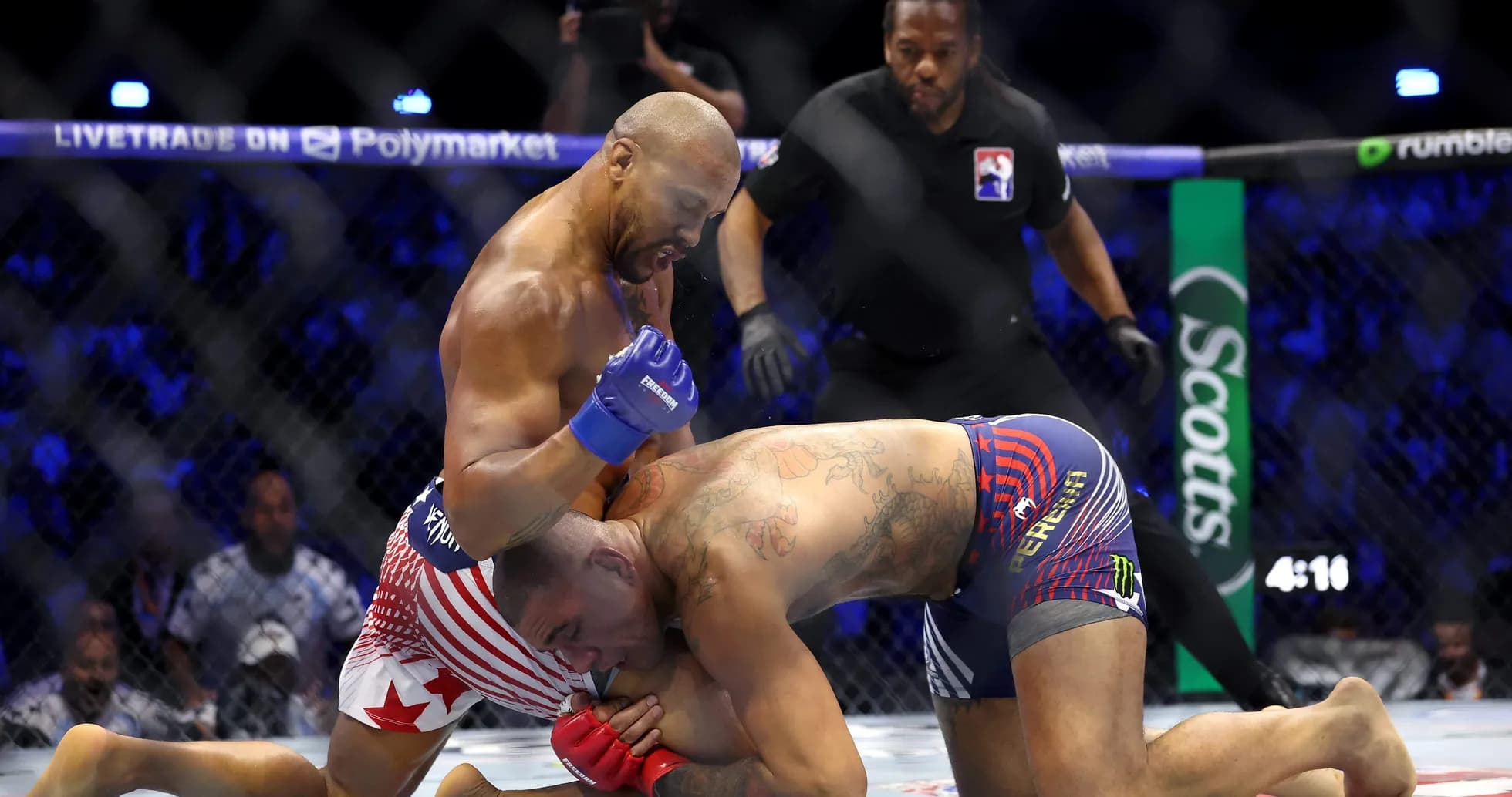 Fighter delivering punches to opponent on mat