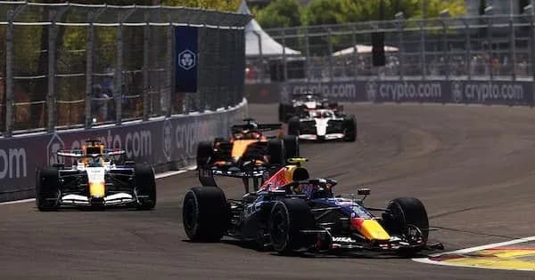 Four Formula 1 cars racing on a track
