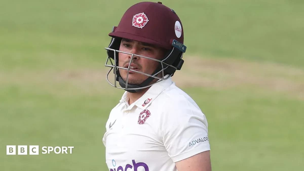 Cricketer wearing helmet during match
