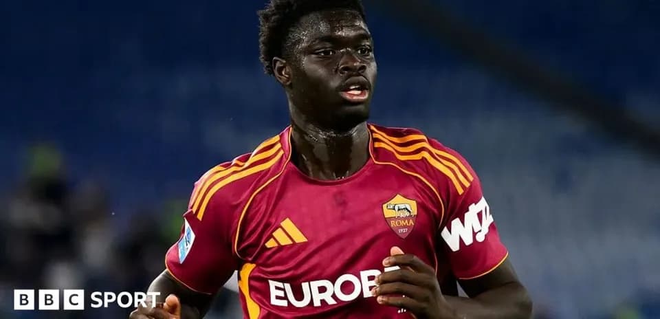 Player in AS Roma kit running on the field