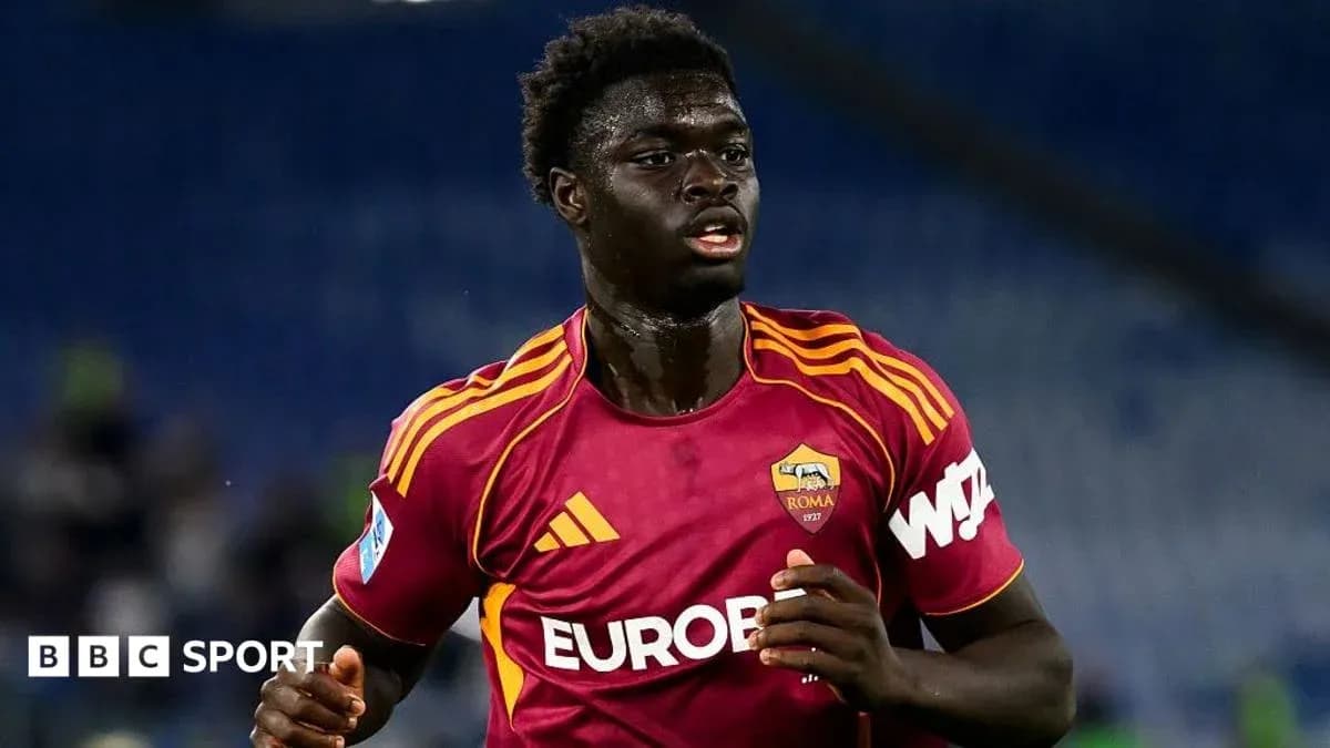Player in AS Roma kit running on the field