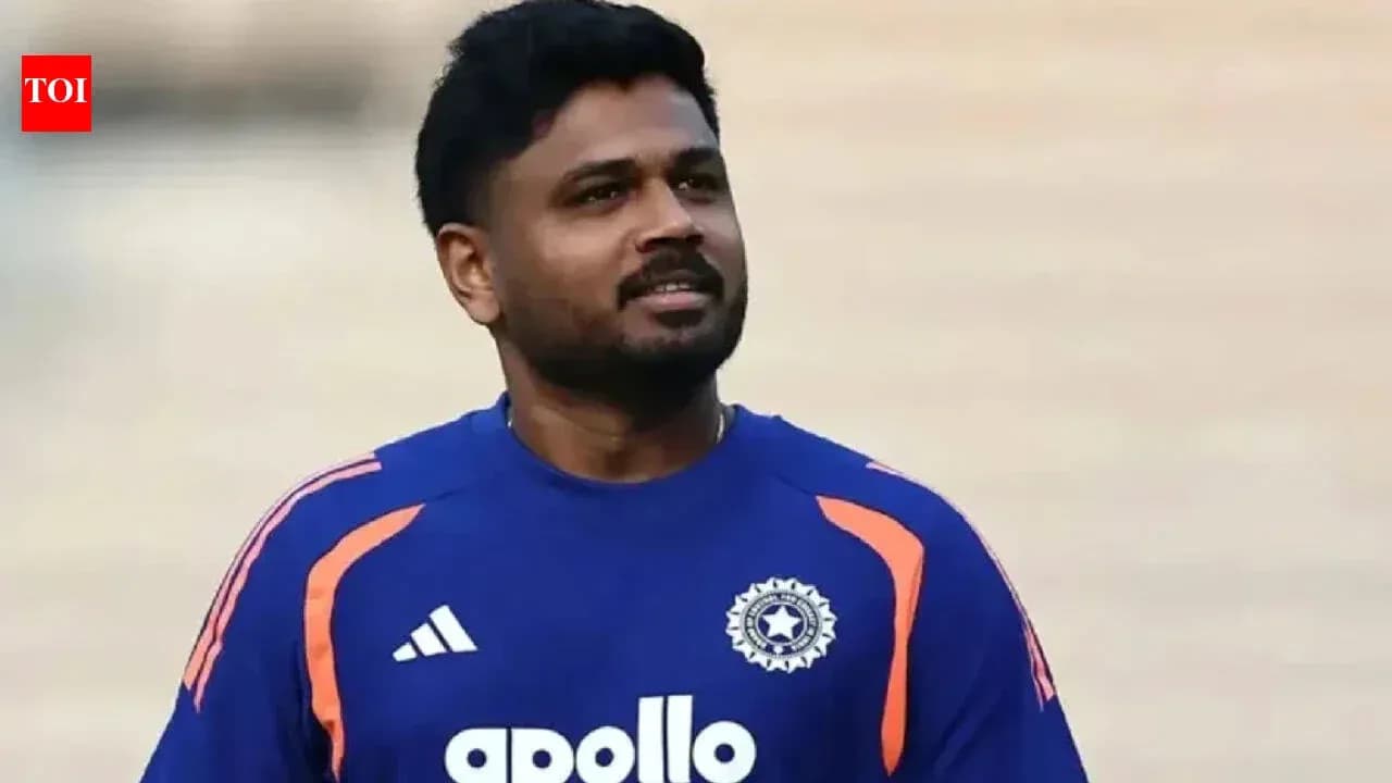 Cricketer wearing blue team jersey during practice