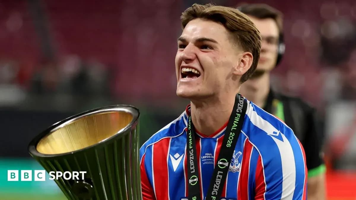 Player celebrating with trophy after match victory