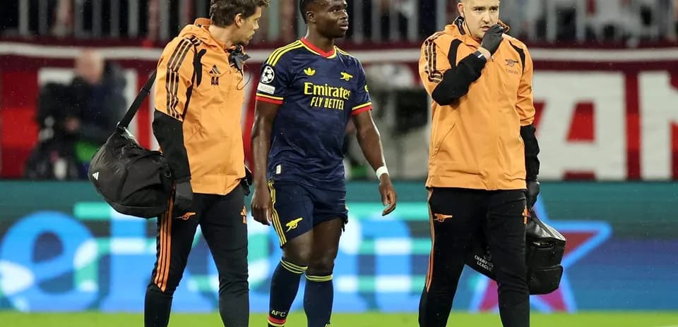 Player receiving medical attention from staff on field