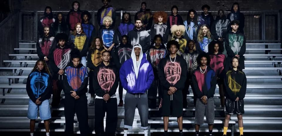 Group of diverse individuals wearing colorful hoodies