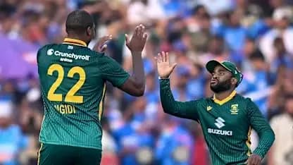 Two South African cricketers celebrating a wicket