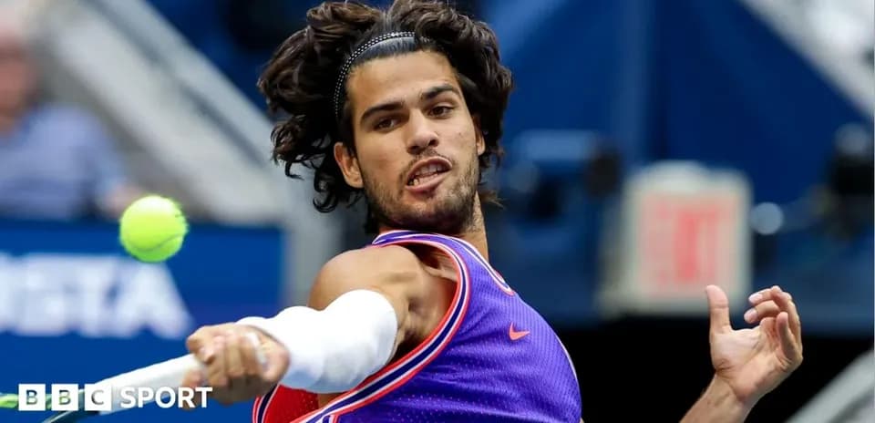 Player hitting a tennis ball during match