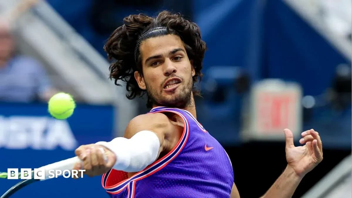 Player hitting a tennis ball during match