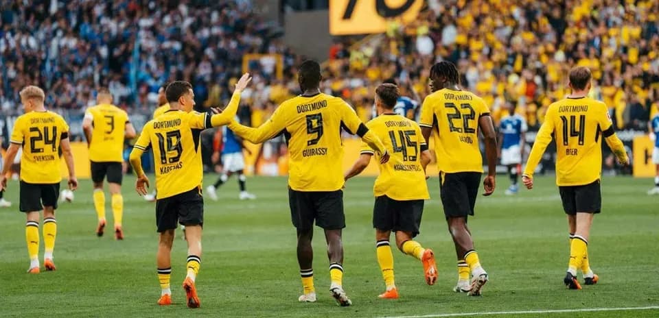 Borussia Dortmund players celebrating a goal together