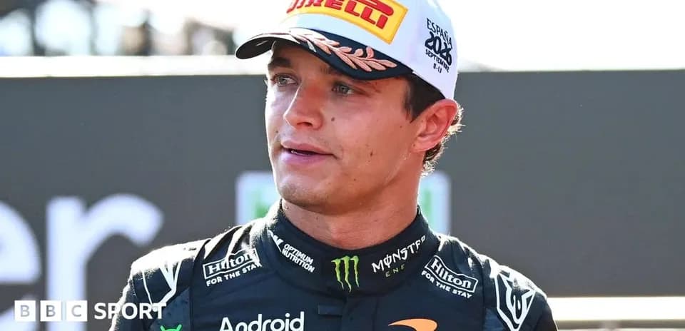 Driver speaking after a race in racing suit
