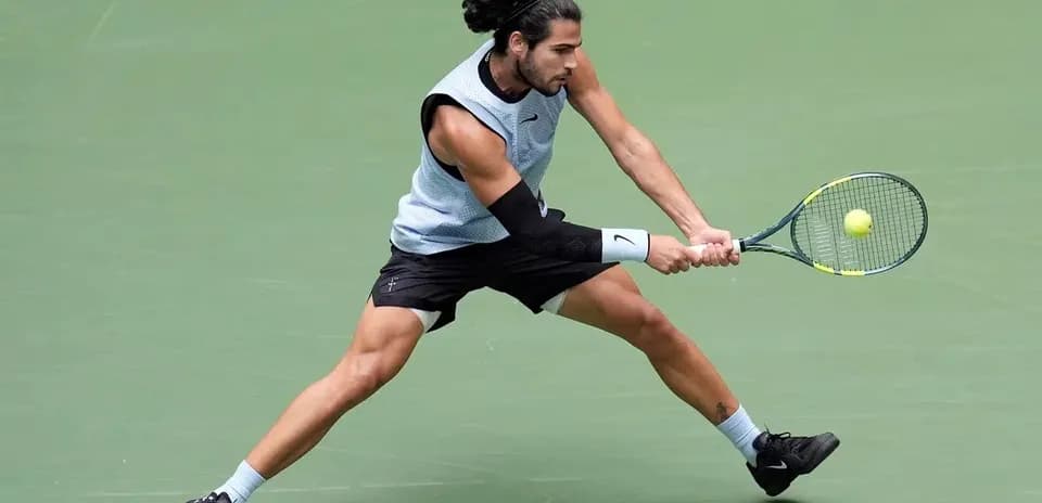 Player executing a backhand shot during match