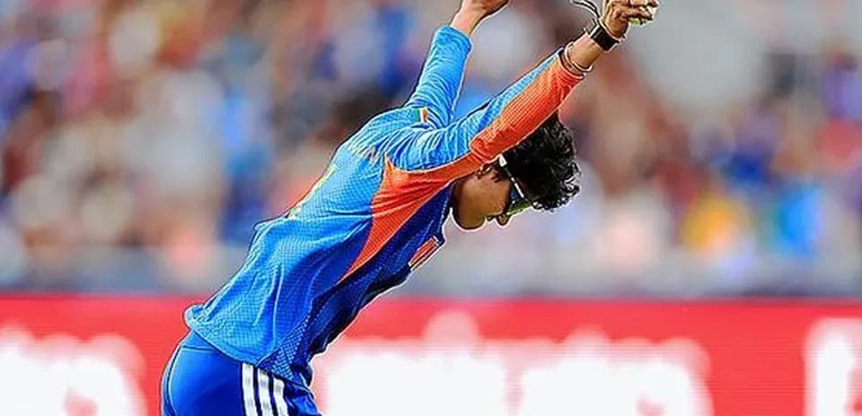 Cricketer celebrating a wicket on the field