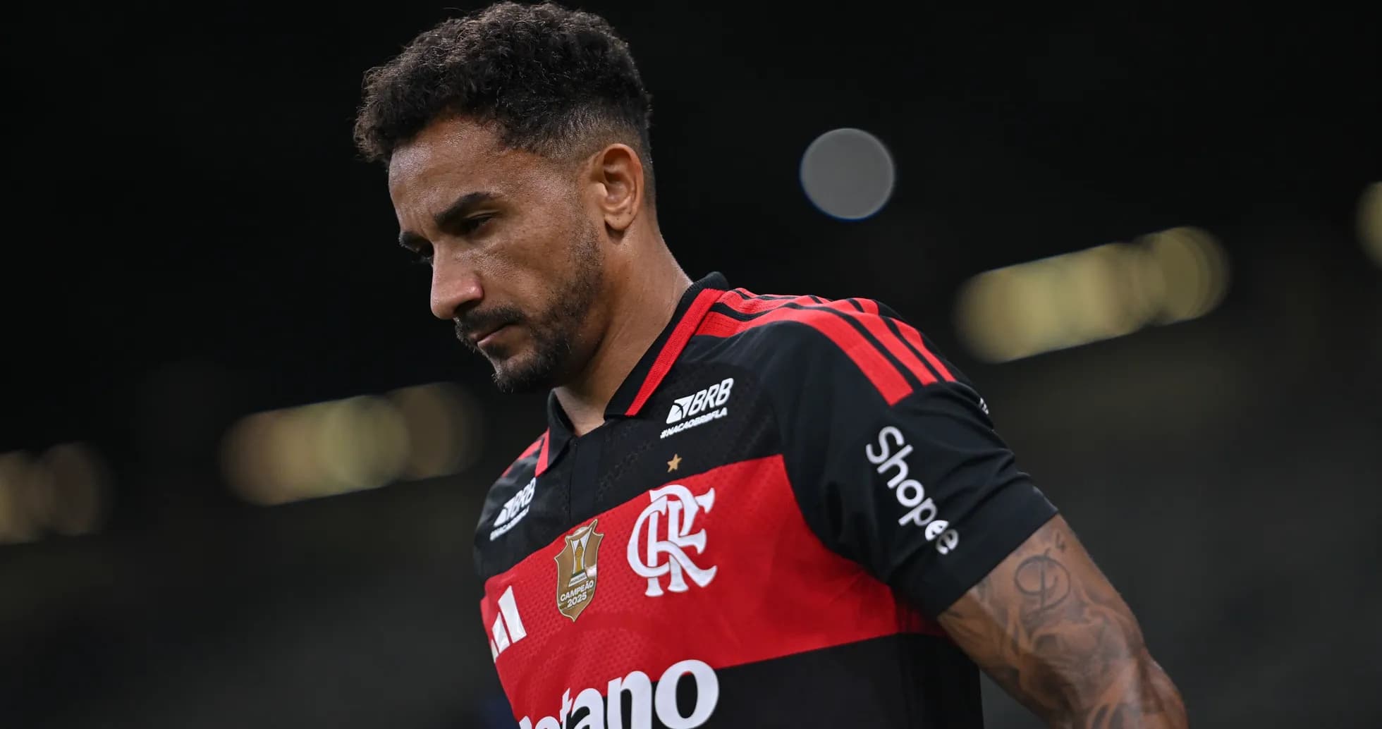 Player wearing Flamengo jersey walking on the field