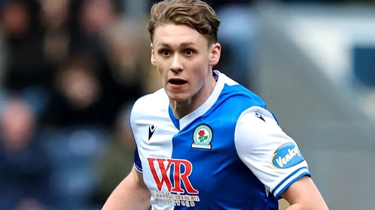 Player in Blackburn Rovers kit running on the field