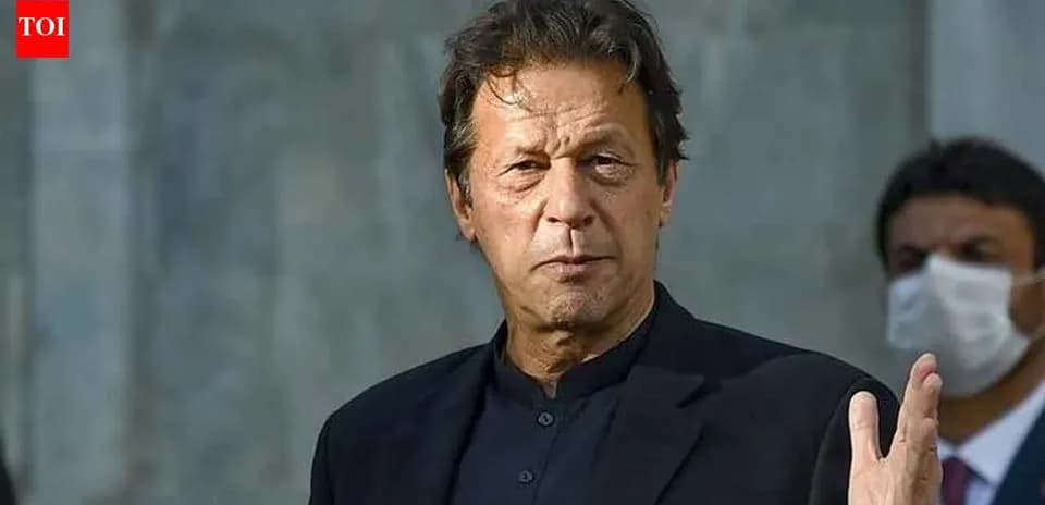Man gesturing while speaking at a public event