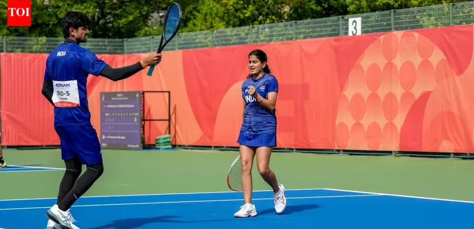 Two tennis players celebrating on court