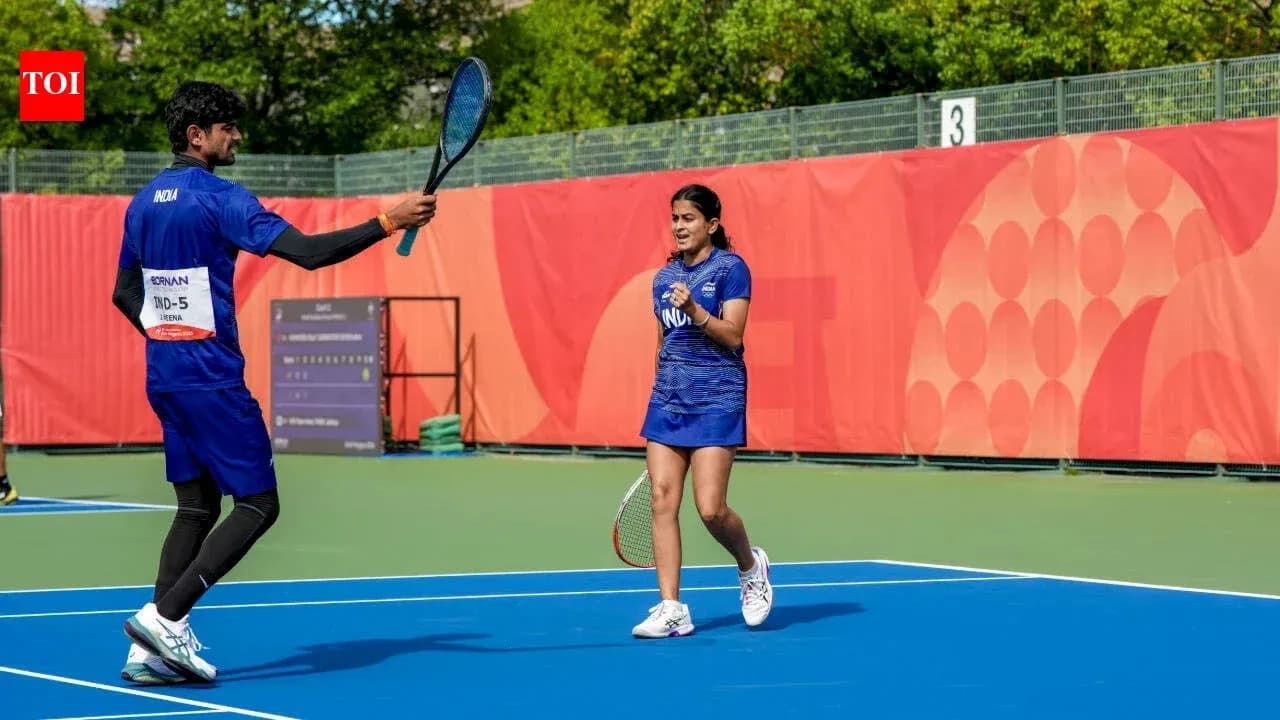 Two tennis players celebrating on court