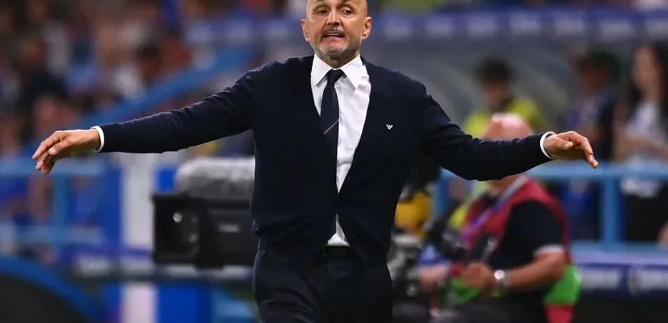 Coach gesturing on the sidelines during a match