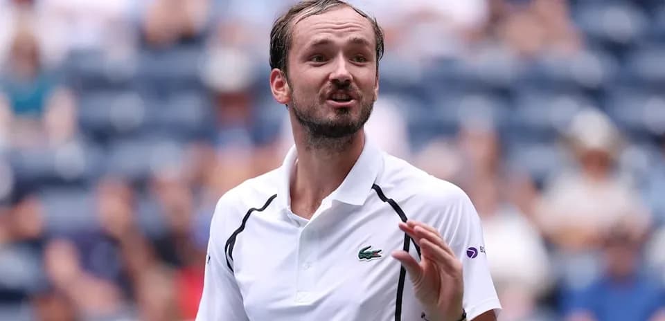 Tennis player speaking during match at stadium