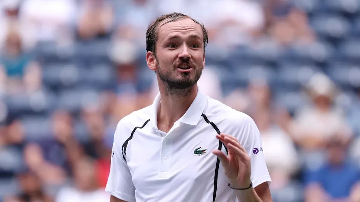 Tennis player speaking during match at stadium