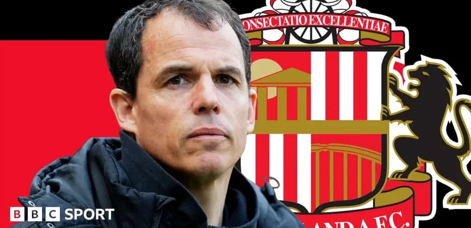 Sunderland manager with club crest background