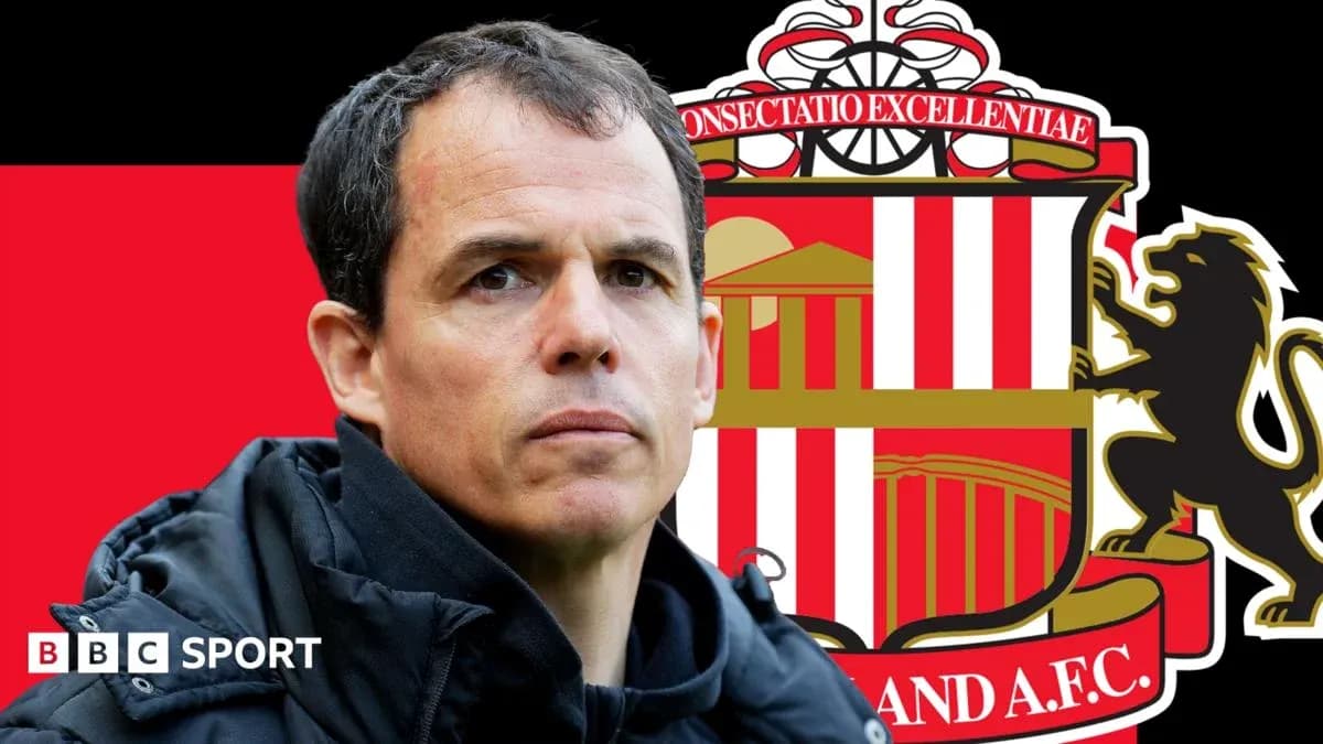 Sunderland manager with club crest background