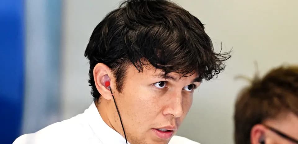 Driver wearing earphones in team setting