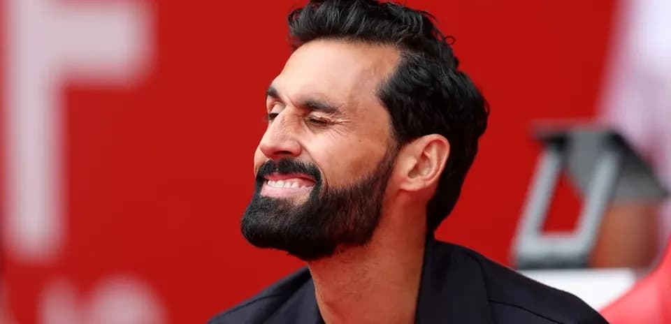 Man smiling while sitting on a bench