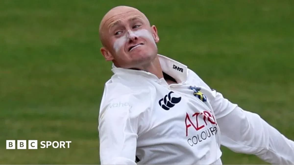 Cricketer delivering a ball on the pitch